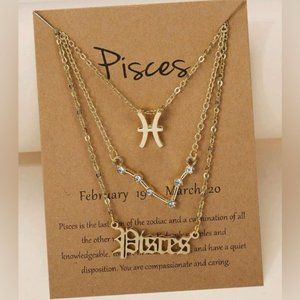 Three piece Pisces necklace set. New.